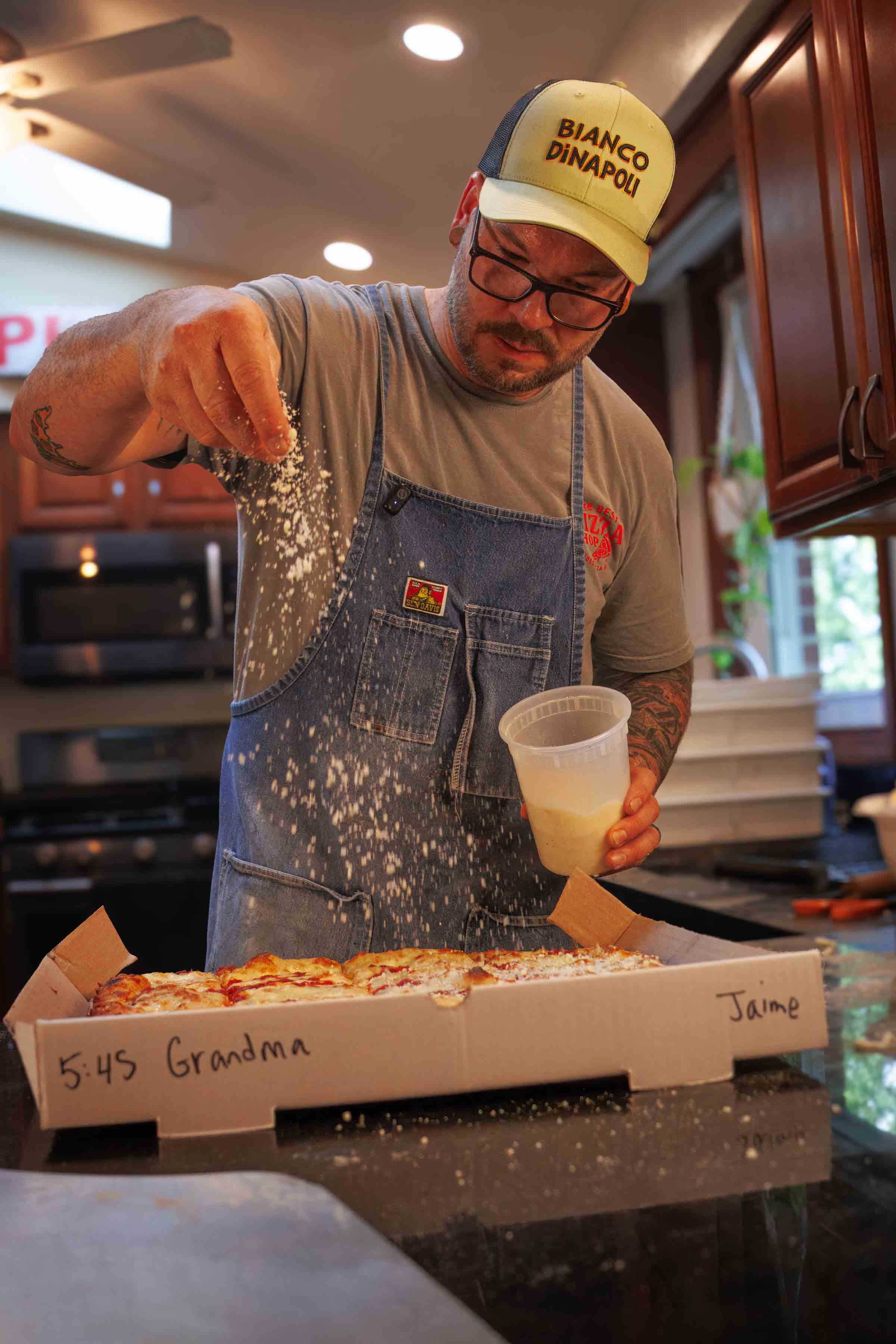 Jesse Wisinski making pizza for The Best Pizza Shop