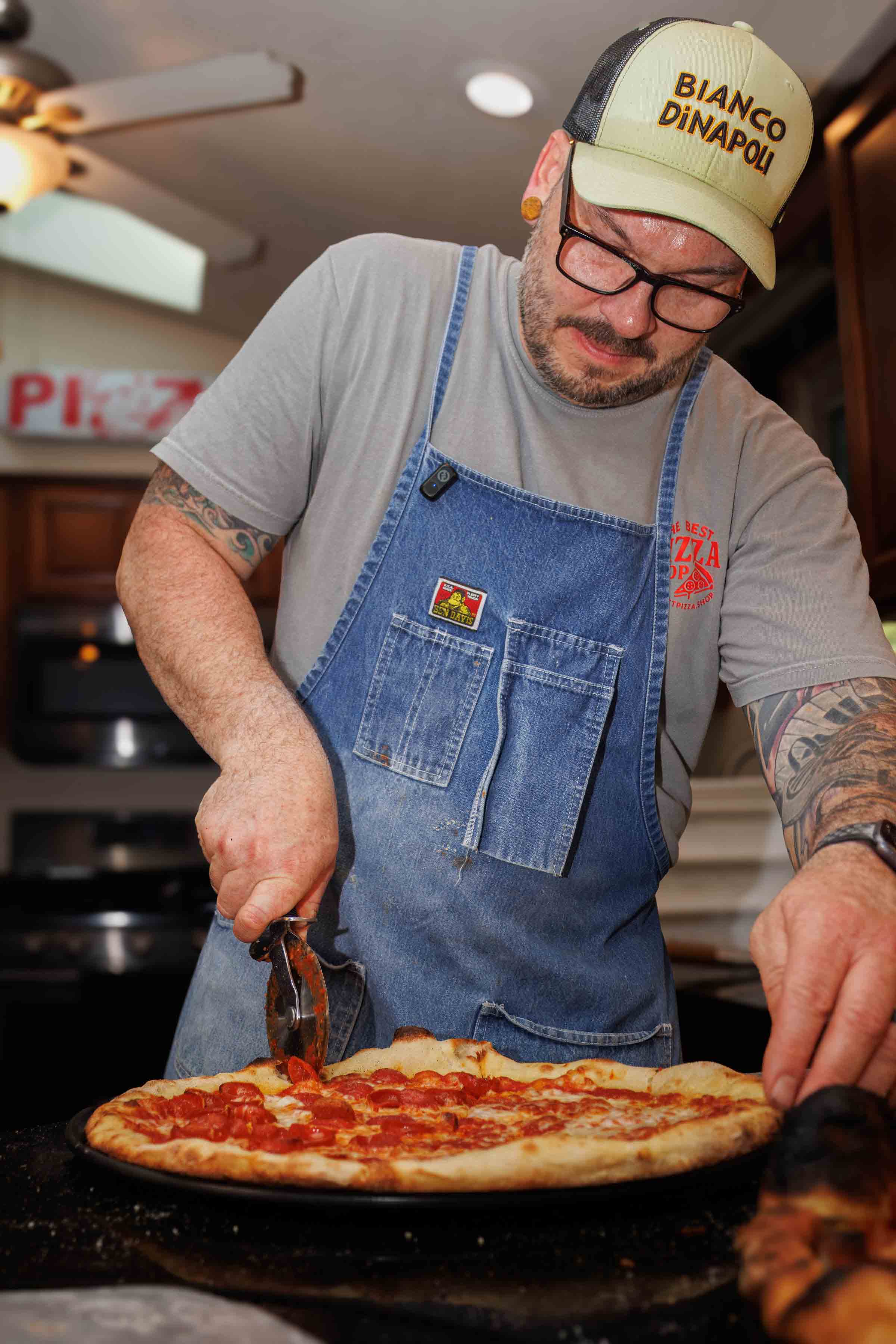Jesse Wisinski stretching pizza dough in Beaver County, Pennsylvania